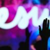Silhouette of a raised hand at a worship concert — Goodbye Yesterday lyrics guide