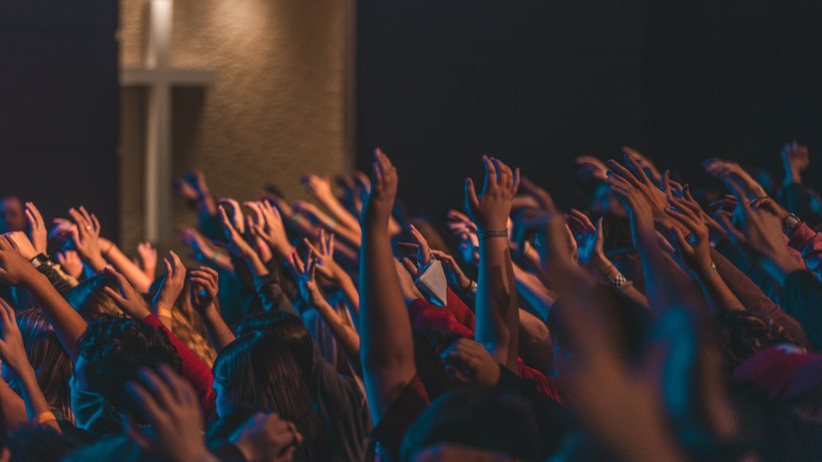Goodbye Yesterday lyrics — young worshippers raising hands in front of a concert stage