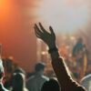 Worshipper raising a hand in praise — Victoria Orenze I Get Backing lyrics guide