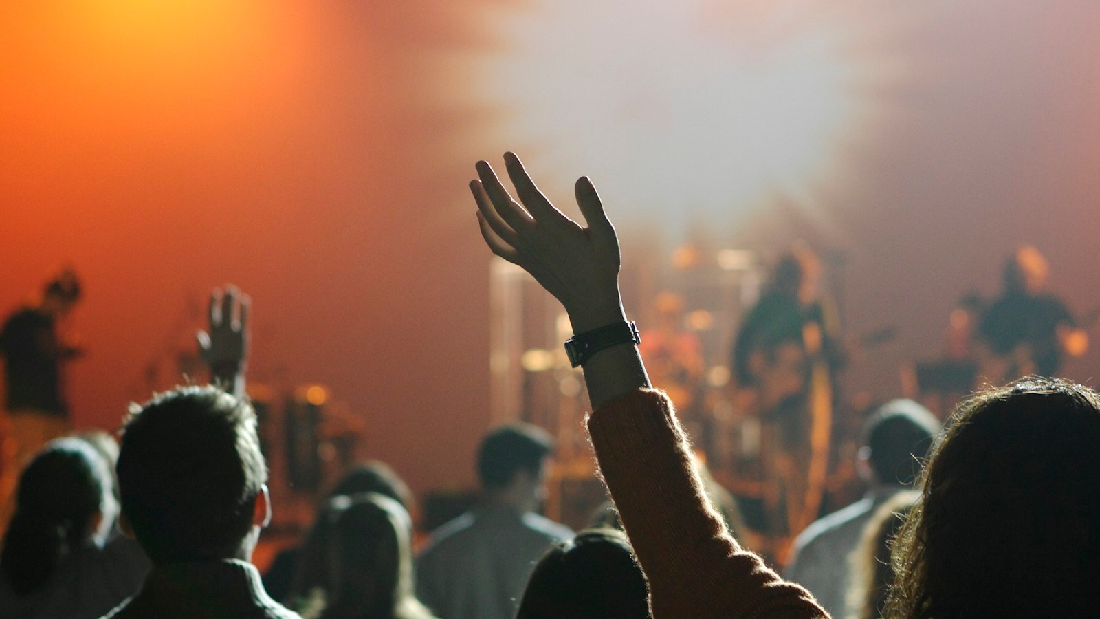 Worshipper raising a hand in praise — Victoria Orenze I Get Backing lyrics guide